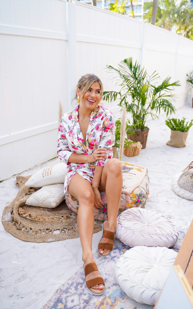 woman sitting wearing silk and sandals summer boho style